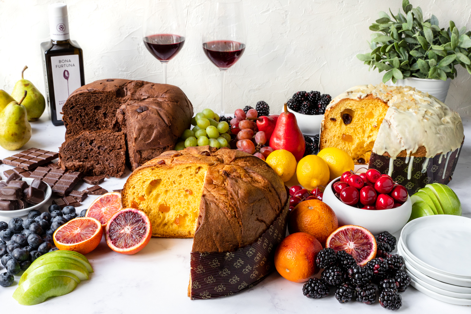 Sicilian panettone, chocolate, citrus and Bona Furtuna olive oil laid out on a holiday table